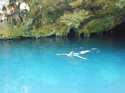 Exploring in Grand Cenote. You can scuba dive in the cenotes too.