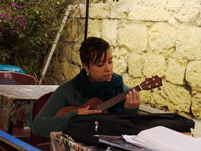 Sarah practices playing City and Colour on her ukulele