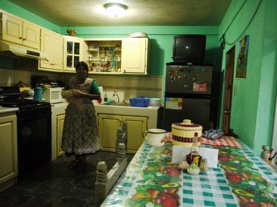 Esperanza working in the kitchen