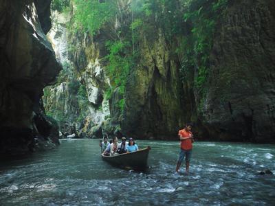 Boqueron canyon. For a small fee a local teenager will paddle visitors up the river.