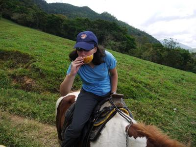 Riding and biting into a giant lemon at the same time, now that's multitasking