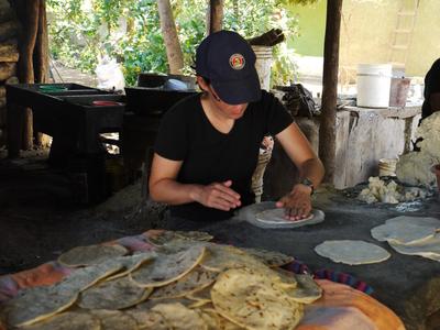 Practicing tortilla-making. That big pile in front is not our handiwork.