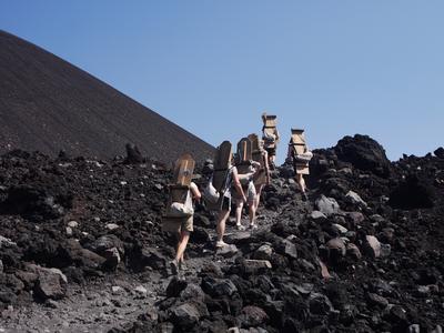 Climbing up Cerro Negro with our standard-issue Quetzaltrekkers volcano boards.