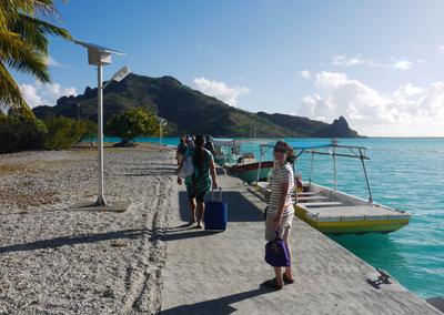 Maupiti's airstrip is located on a motu off the main island. In outlying island tradition, the 'terminal' is a small open shelter, with a couple of airline personnel to collect tickets and help with luggage. There's a tiny snack bar (open for the daily flight) and a pier for the boats that take passengers to the island. The shelter floor is a bed of seashells - nice touch, if a bit impractical for rolling luggage.