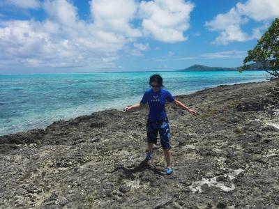 Walking carefully on the makatea (elevated reef). It's sharp.