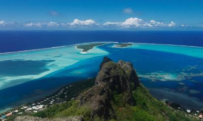 On top of the world, or at least top of Maupiti. Hotu Parata in the foreground, motu Pitiahe and Tiapaa behind, enclosing the only pass through the reef between them