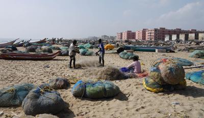 Fishermen at work, and Chennai cityscape