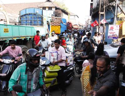 Driving into the city of Kochi / Cochin and straight into massive gridlock. Note the flag of the Communist Party of India (Marxist), the largest political party in Kerala.