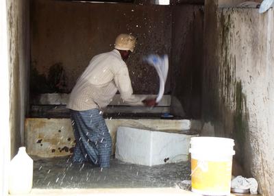 At the city laundry. The customers are mostly businesses - hotels and such. The workers belong to a tightly controlled guild.