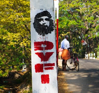 Pretty sure that's Che Guevara promoting the DYFI, the youth wing of the Communist Party of India (Marxist).