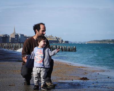 Leaving Saint-Malo via the boardwalk. The tide was high and the wind was blowing. At one point, a robust saltwater spray landed in Adam's trailer. The last part of the boardwalk was basically underwater, so we had to come up with a detour.