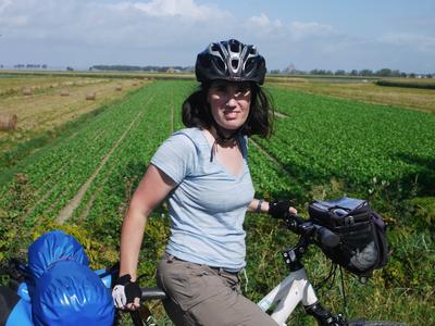 One of our first views of Mont Saint-Michel (just to the right of Dana's helmet). It's surprising how rural and sparsely inhabited the area around the Mont is.