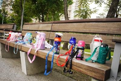 At the playground. Taipei kids (or more likely their parents) take their water bottles very seriously.