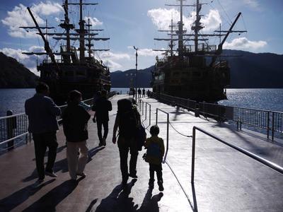 Boarding a lake cruise. The ferries on Ashinoko are designed to resemble man-o'-war ships. The masts and sails are just for show.