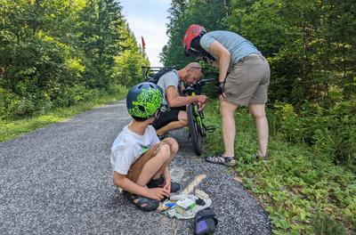 Our only mechanical issue along the route - a misaligned brake on Adam's bike - resolved with some help from local riders.