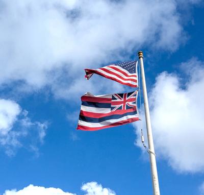 At the Kipahulu visitor center. <br/> If someone had asked me to guess what the flag of Hawaii might look like, this design would be about as far from my guess as possible. Hawaii was never a British possession, but king Kamehameha I, who first united the islands under one kingdom, was friendly with Britain, and apparently a bit of a fan. <br/> This flag has been in use in Hawaii for over 200 years. It persisted through the overthrow of the Hawaiian Kingdom by U.S.-backed rebels in 1893, the annexation to the United States in 1900, and the declaration of statehood in 1959.